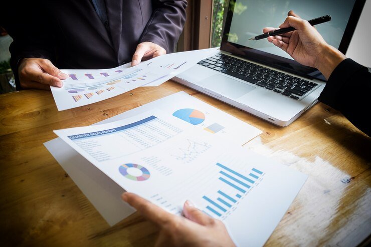 business team working new business plan with modern digital computer 1423 58