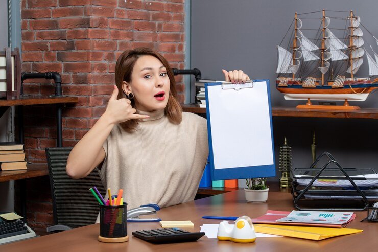 front view pretty woman holding clipboard making call me sign office 140725 109229