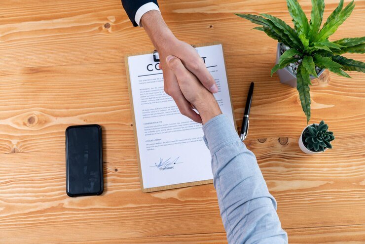 two business people shake hand after successfully signing contract entity 31965 163084